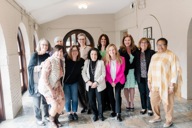 Group of clients gathered for Women Amongst Tea Event